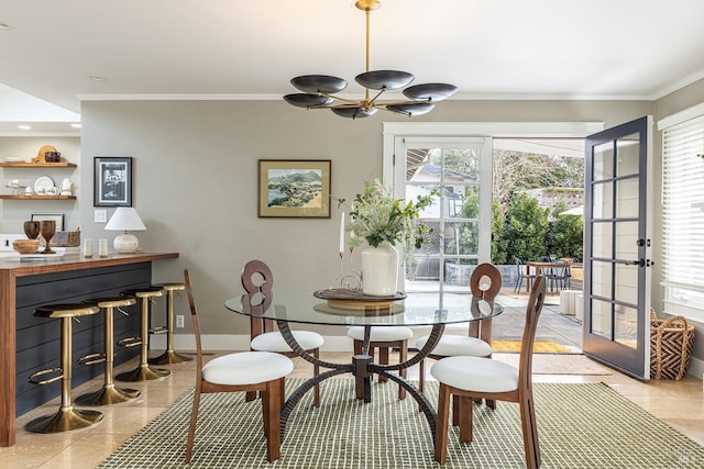 tiled dining room featuring a fireplace, crown molding, and a wealth of natural light