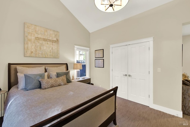 bedroom featuring high vaulted ceiling, baseboards, dark colored carpet, and a closet