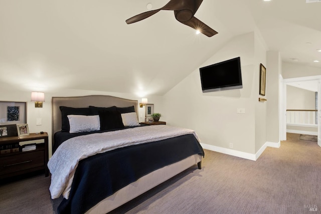 bedroom featuring carpet floors, vaulted ceiling, baseboards, and ceiling fan