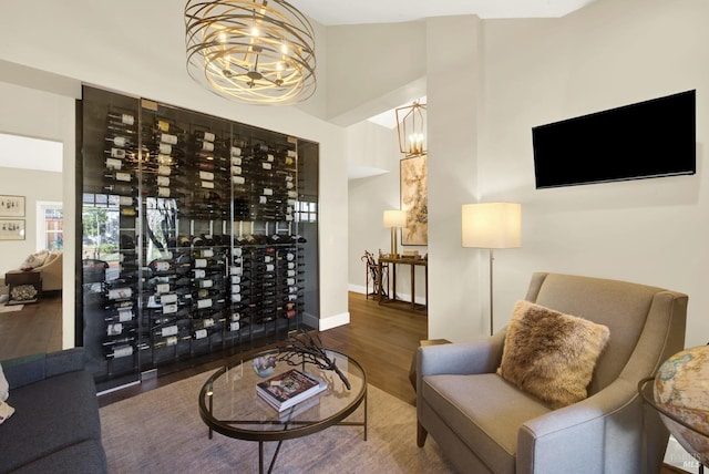 interior space with dark wood-style floors, baseboards, and a notable chandelier