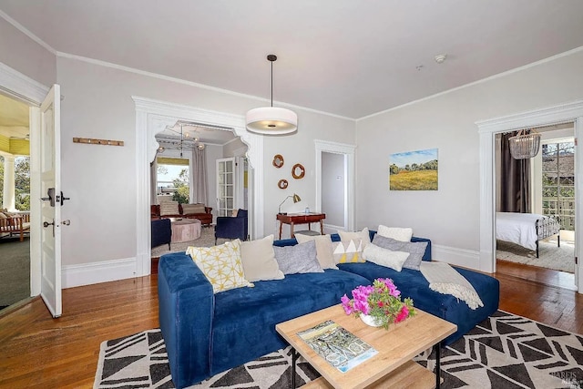 living room with plenty of natural light, dark wood-type flooring, and french doors