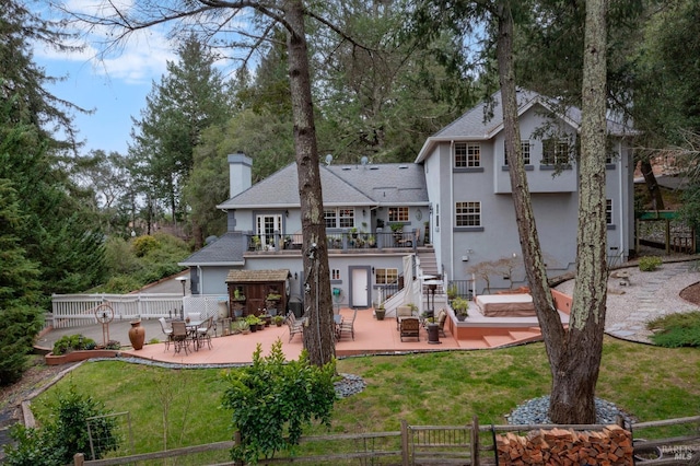 rear view of house with a patio, stairway, fence, and a balcony