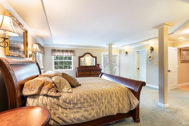 bedroom with decorative columns, ornamental molding, carpet, and baseboards