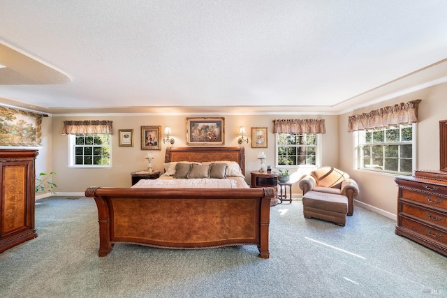 bedroom featuring crown molding, carpet, baseboards, and a textured ceiling
