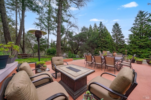 view of patio / terrace featuring an outdoor hangout area, fence, and outdoor dining space
