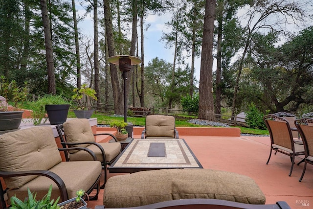 view of patio / terrace with outdoor dining area, an outdoor hangout area, and fence