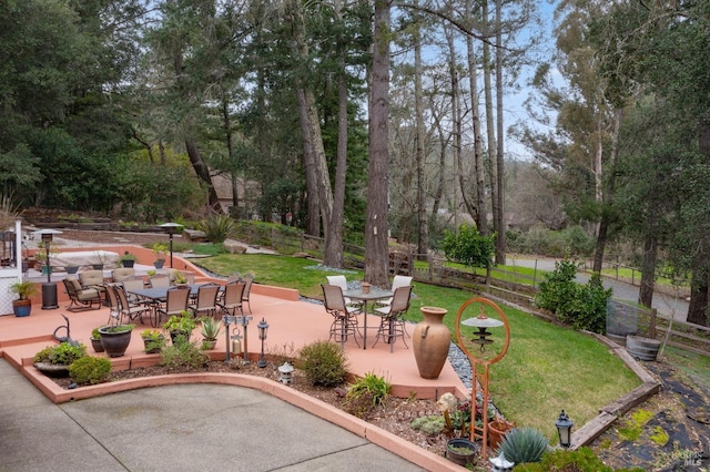 view of patio featuring fence