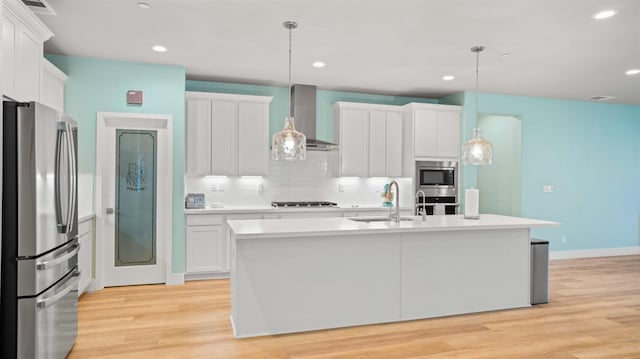 955 Vasey St, Winters, CA 95694 - kitchen with stainless steel appliances, a sink, wall chimney range hood, light countertops, and decorative backsplash