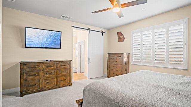 955 Vasey St, Winters, CA 95694 - bedroom featuring a barn door, carpet, ceiling fan, and baseboards