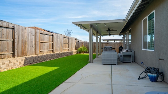 view of patio / terrace featuring ceiling fan and a fenced backyard