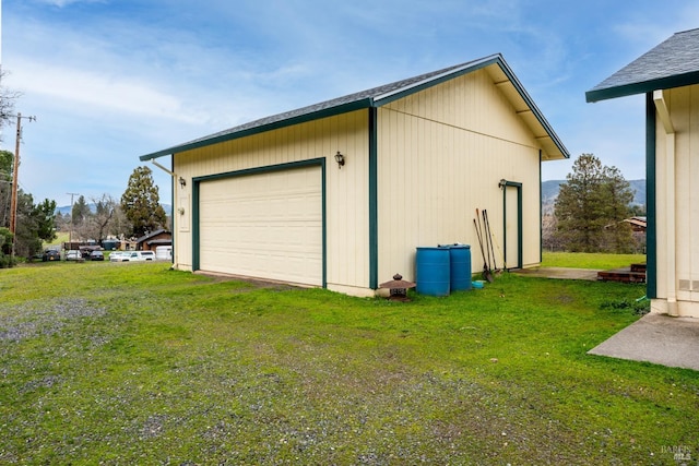 garage featuring a lawn