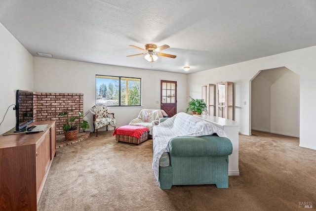 interior space featuring a textured ceiling and ceiling fan