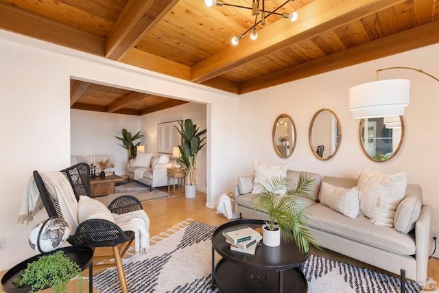 living room featuring light wood-type flooring, beamed ceiling, and wooden ceiling