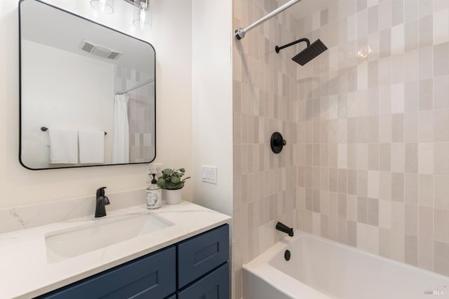 bathroom with vanity and shower / tub combo