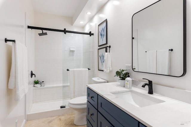 bathroom featuring tile patterned floors, toilet, vanity, and an enclosed shower