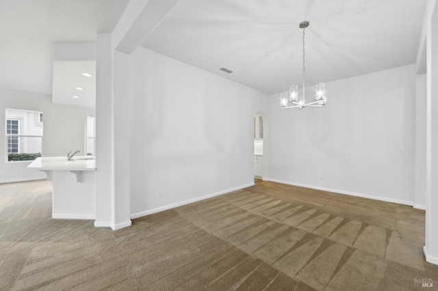 interior space featuring sink and a notable chandelier