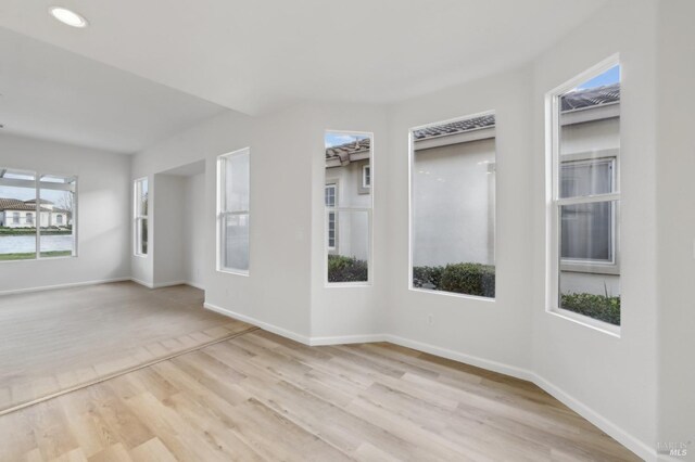 unfurnished room featuring light hardwood / wood-style floors