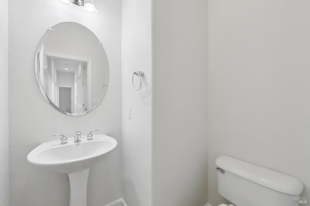 bathroom featuring toilet