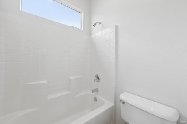 bathroom featuring toilet and bathtub / shower combination