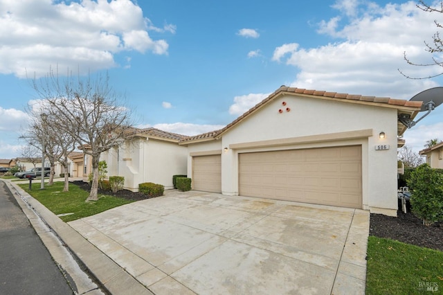 506 Quail Walk Way, Rio Vista, CA 94571 - mediterranean / spanish-style house with concrete driveway, an attached garage, stucco siding, a tiled roof, and a front lawn