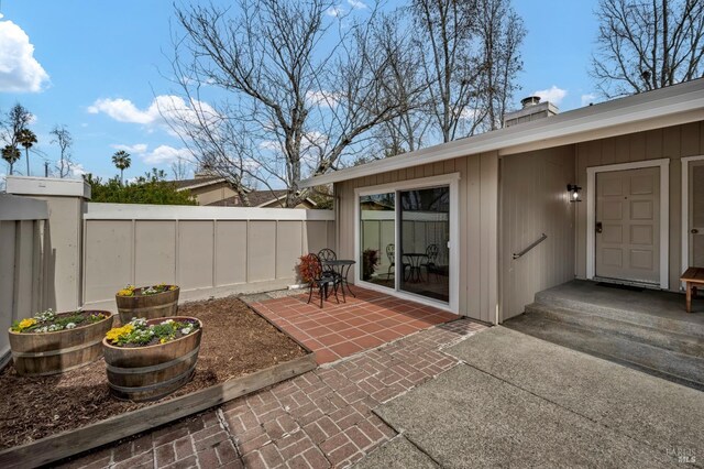view of patio / terrace featuring fence