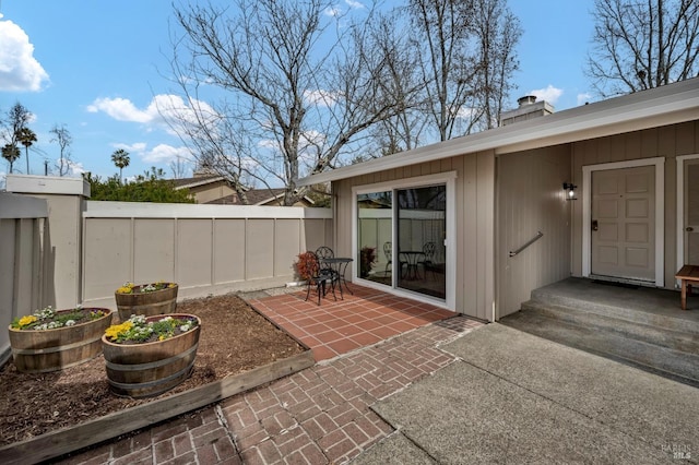 view of patio / terrace featuring fence