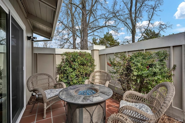 balcony with a patio and a fire pit