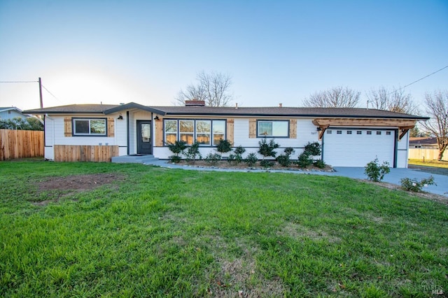 single story home featuring a front lawn and a garage