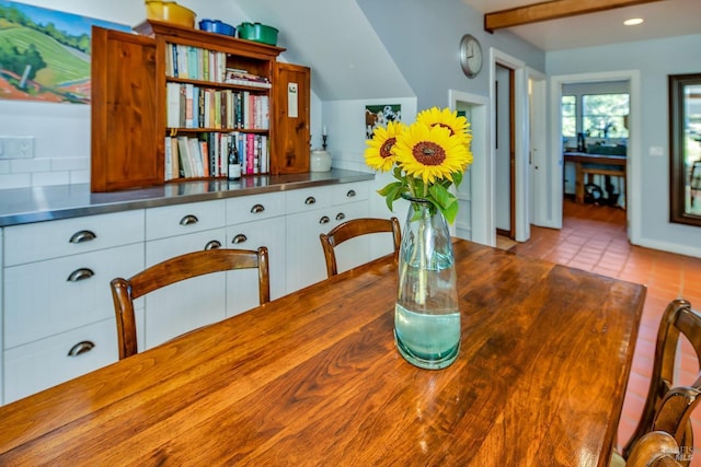 dining space featuring recessed lighting and lofted ceiling