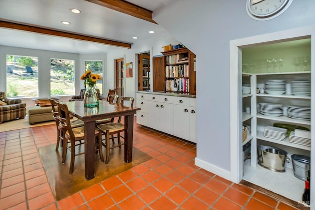 dining space with recessed lighting, beamed ceiling, and dark tile patterned floors