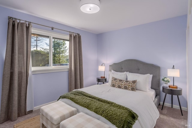 carpeted bedroom with baseboards