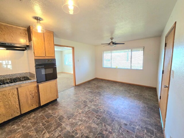 carpeted spare room featuring visible vents, a textured ceiling, and baseboards