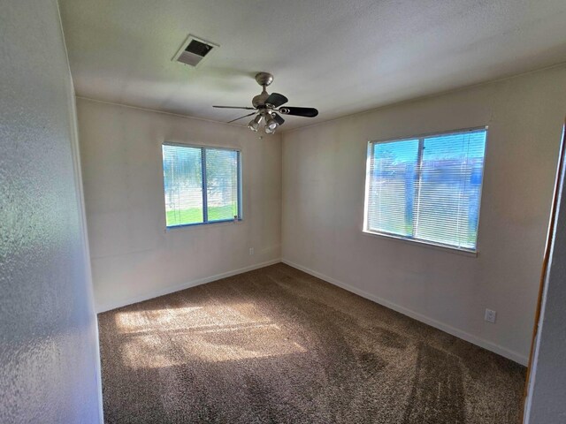 bathroom with toilet, stone finish floor, shower / tub combination, and vanity