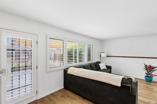 living room featuring baseboards and wood finished floors