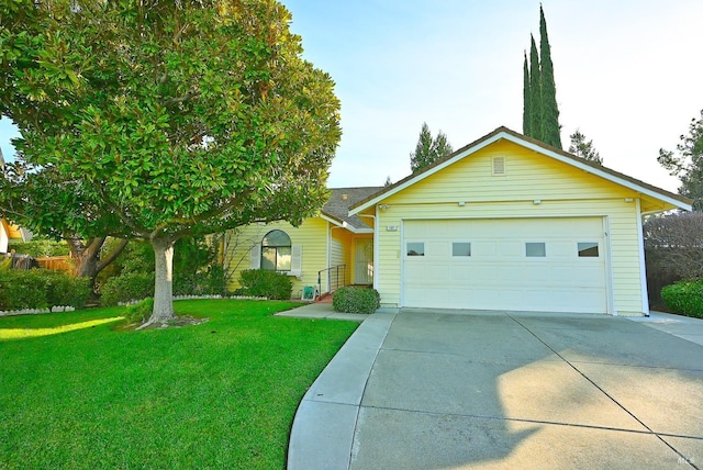 ranch-style home featuring an attached garage, concrete driveway, and a front yard