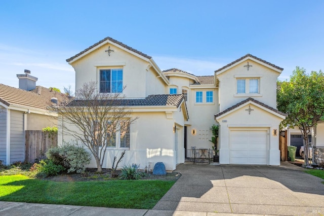 mediterranean / spanish house featuring driveway, a tile roof, an attached garage, fence, and stucco siding