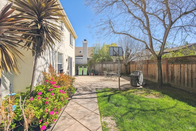 view of yard featuring a patio and fence