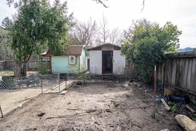 rear view of property with a fenced backyard