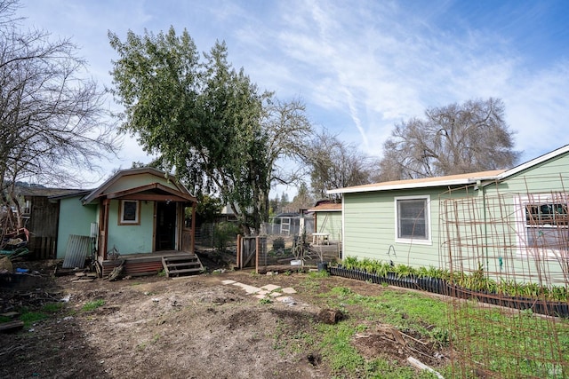 view of property exterior with fence