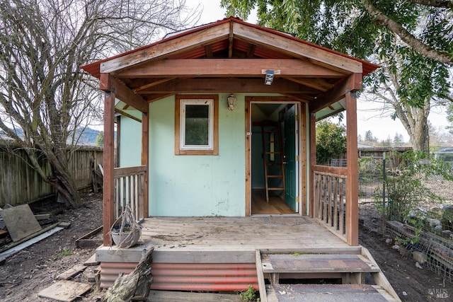 exterior space with fence and a wooden deck