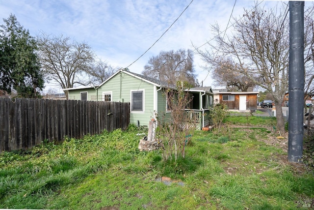 view of property exterior featuring fence