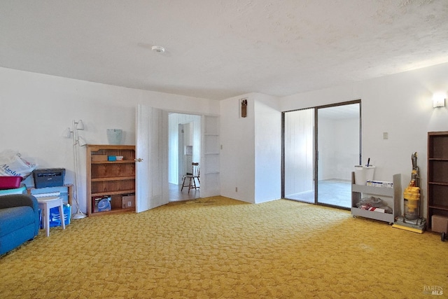 carpeted bedroom featuring a closet and a textured ceiling