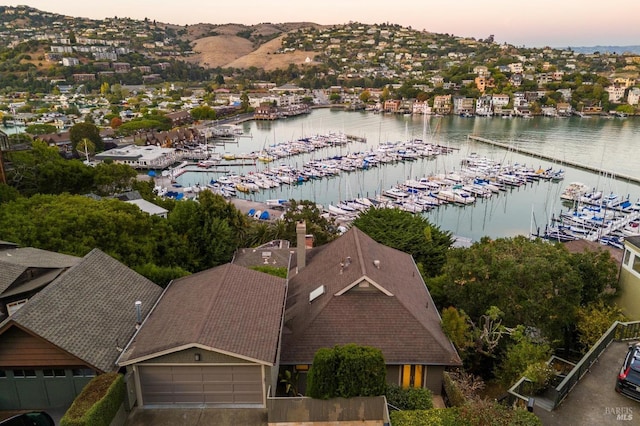 aerial view at dusk with a water view