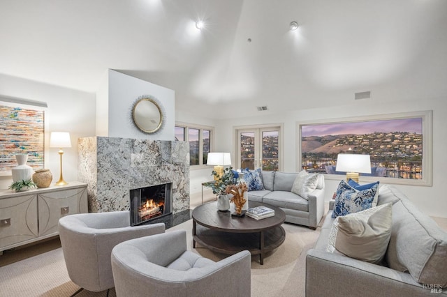 living area with visible vents and a fireplace