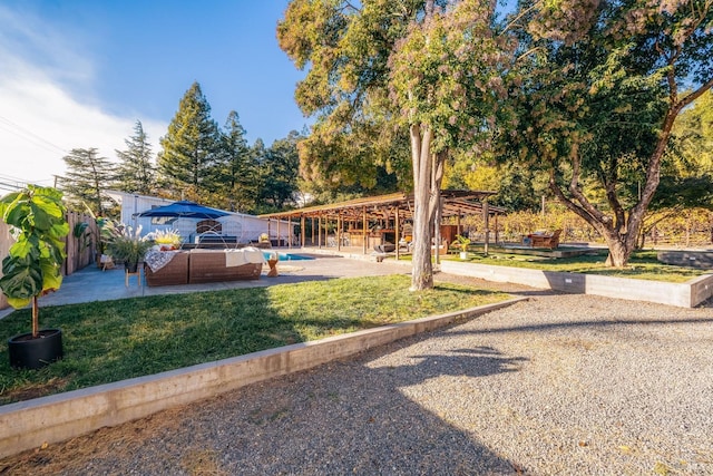 view of yard featuring an outdoor pool, a patio area, a fenced backyard, and outdoor lounge area