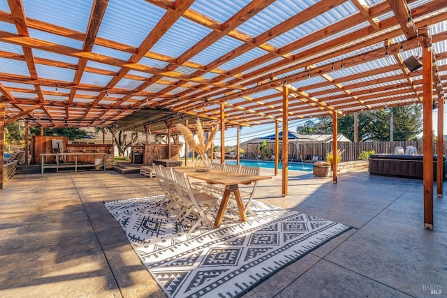 view of patio / terrace with outdoor dining area, a fenced backyard, a fenced in pool, and a pergola