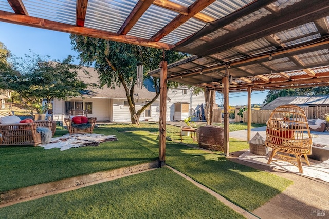 view of yard featuring a patio area, fence, and a pergola