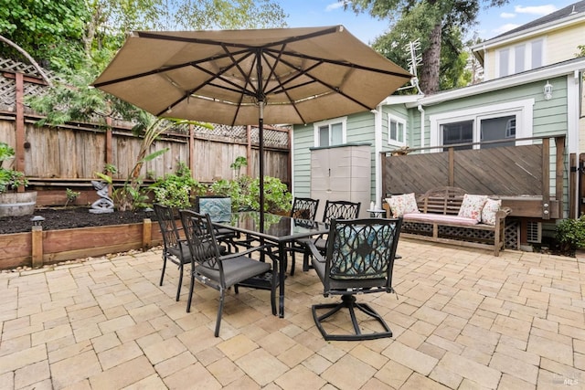 view of patio / terrace featuring outdoor dining area and a fenced backyard