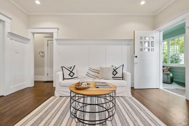 living area featuring crown molding, recessed lighting, and dark wood finished floors