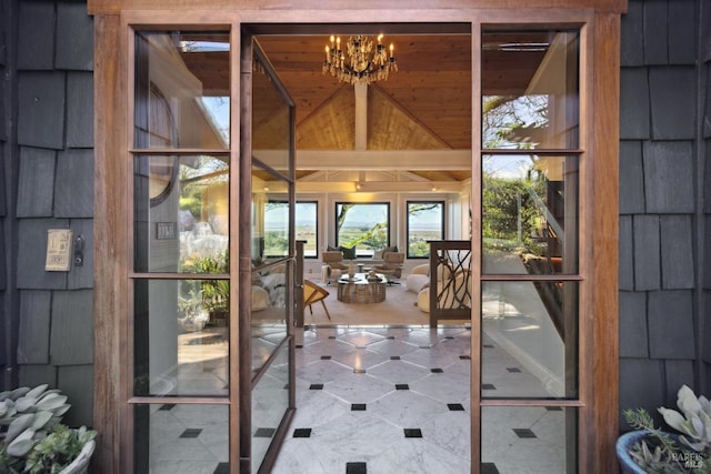 entryway with a chandelier